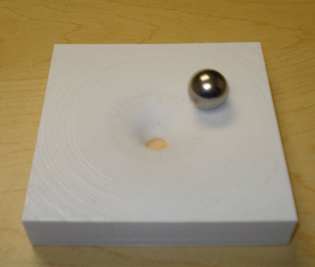 Picture of 10x10x2 cm Gravitational Potential well with metal ball in orbit.