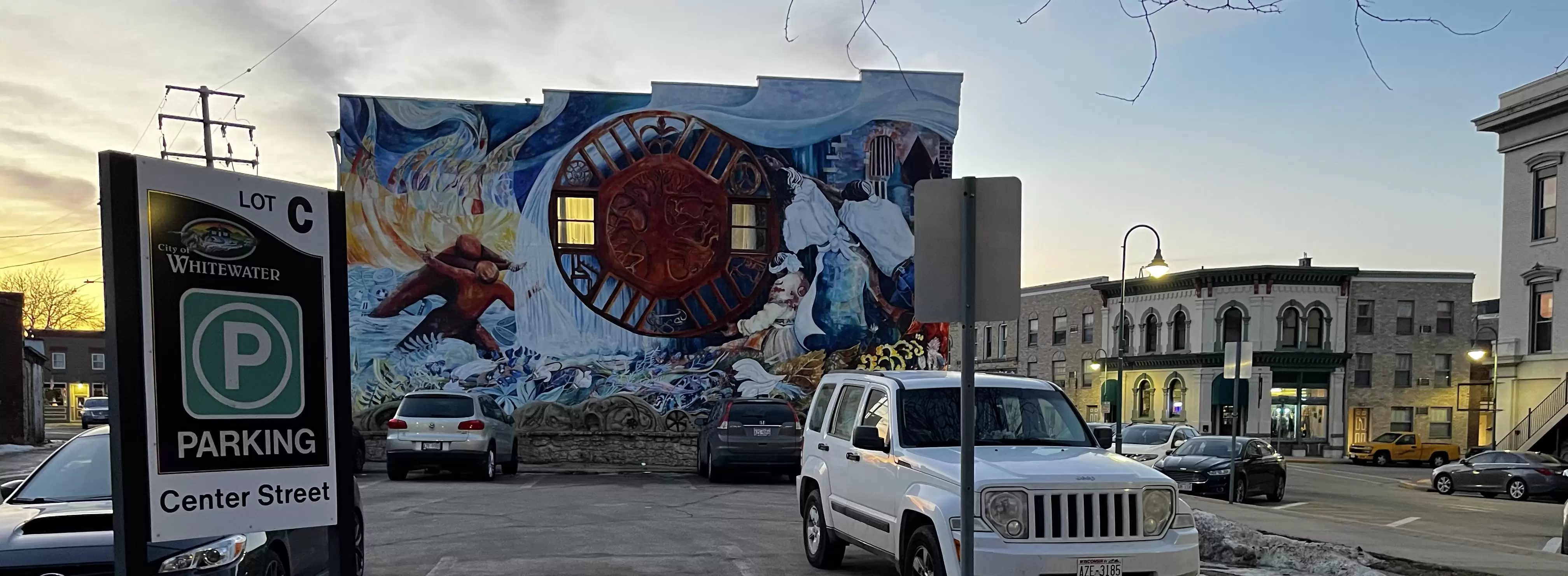 Prairie Tillers mural with parking sign
